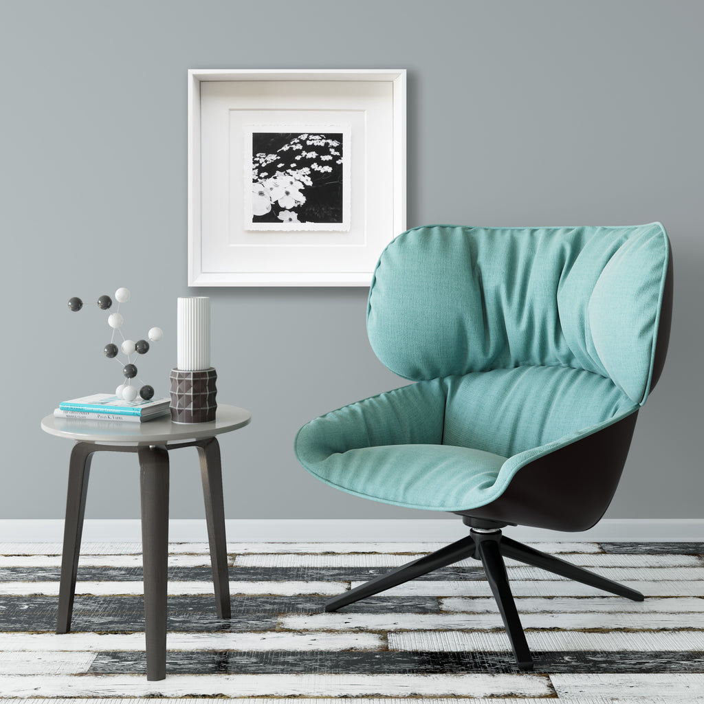 Torn-edge framed black and white fine art photo shown with interior decor 